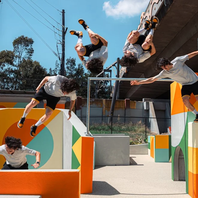 Man doing parkour flip in Junction Street Plaza
