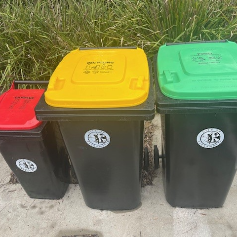 Three bens with red, yellow and green lids